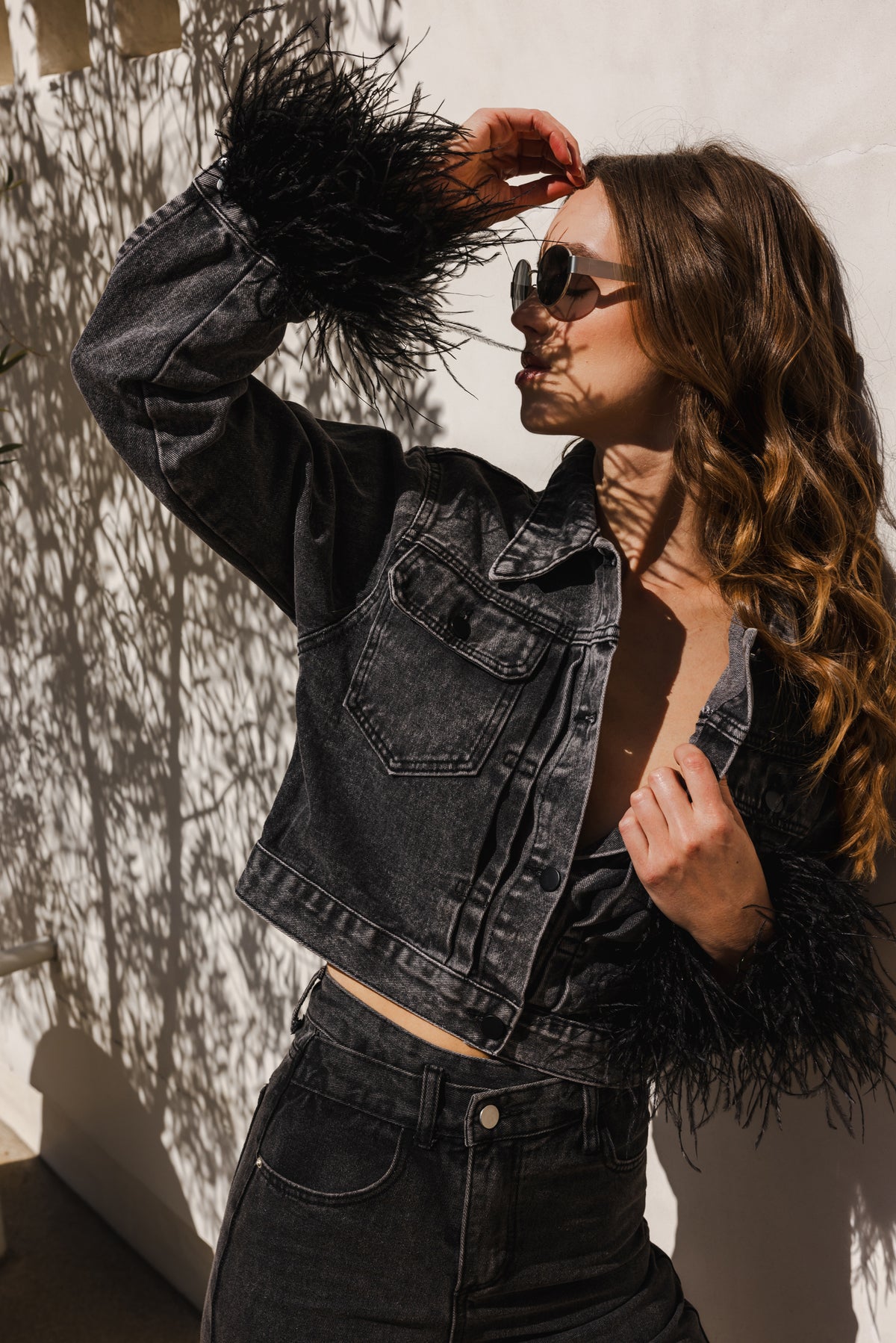 The Raya Denim Cropped Feather Trim Jacket in Black