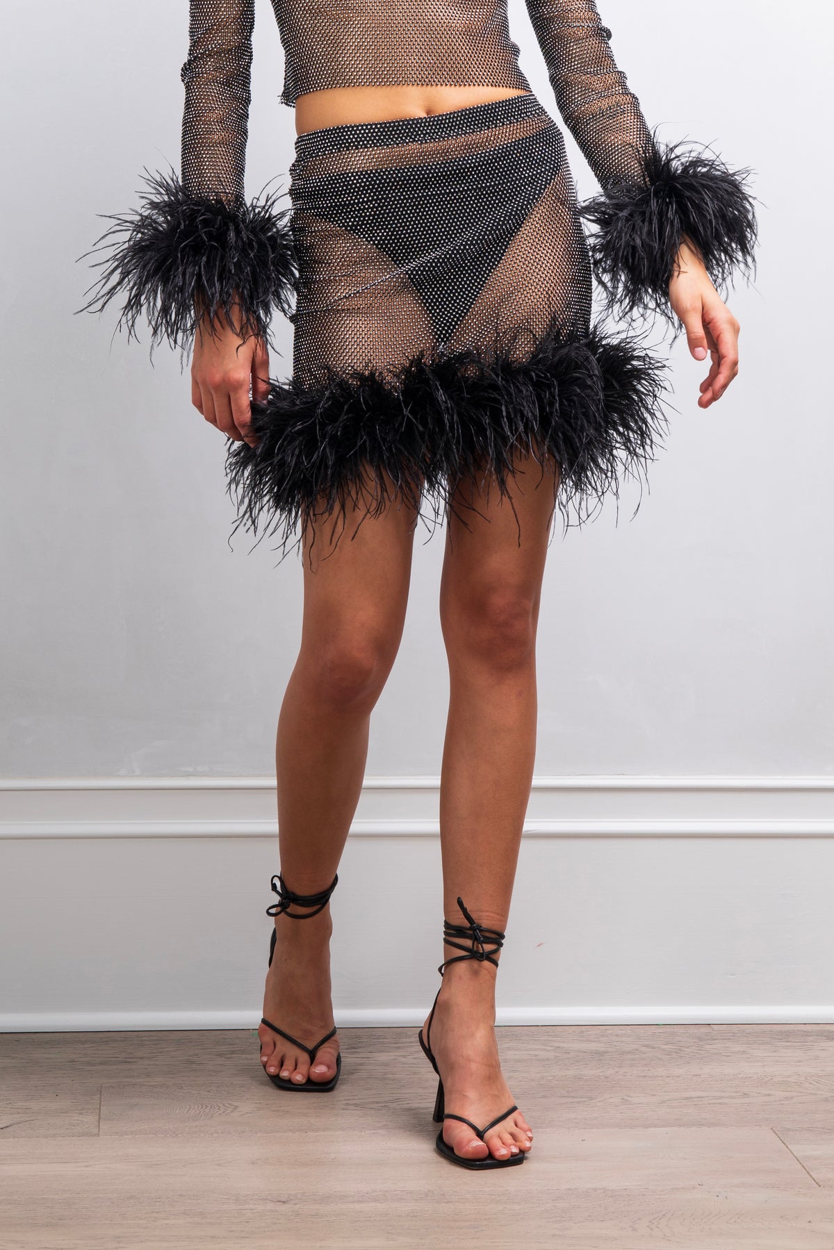 Nestle in rhinestone feather mini skirt in Black
